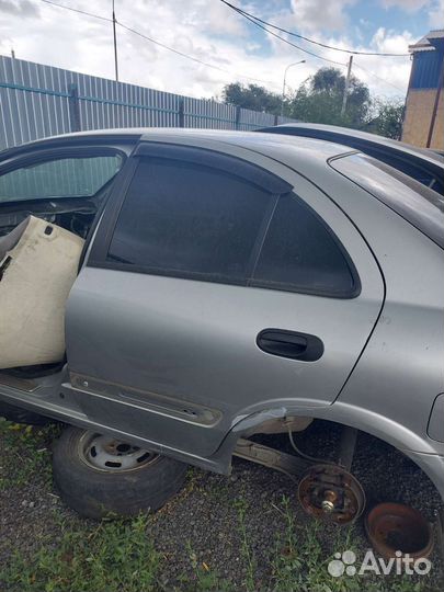 Дверь задняя правая на Nissan almera N16