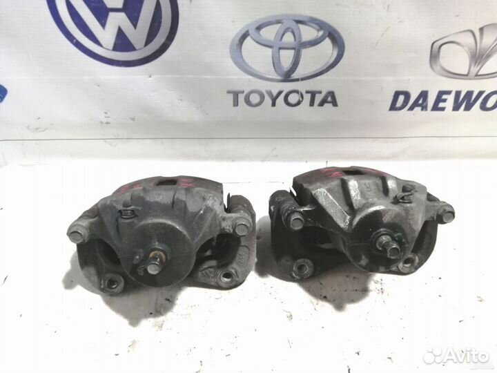 Суппорт тормозной передний Kia Sportage 2 KM