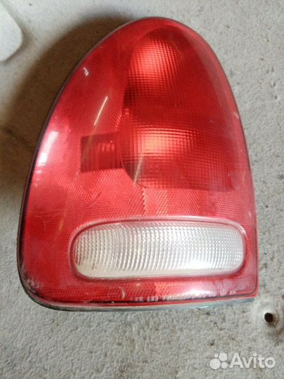 Задний фонарь левый задний левый Dodge Caravan