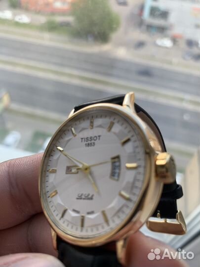 Зодотые часы Tissot