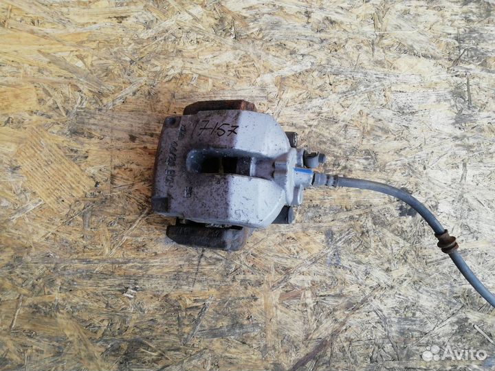 Суппорт тормозной задний левый BMW X5 F15