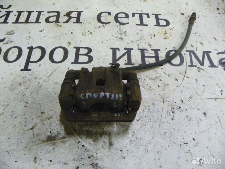 Суппорт тормозной задний левый Kia Sportage II (20