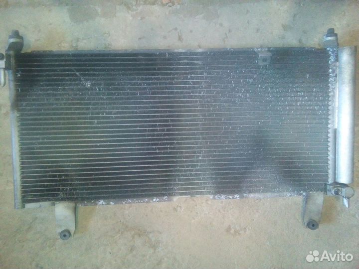 Радиатор кондиционера Suzuki Aerio RA21S