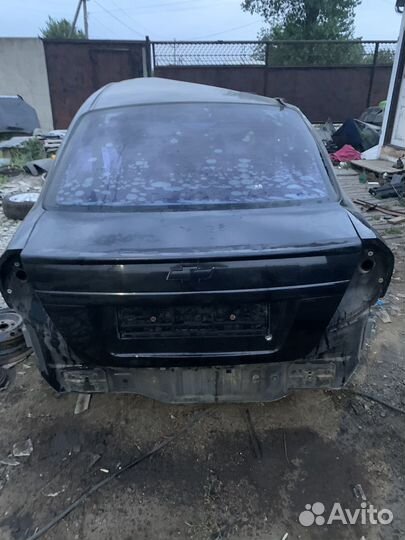 Chevrolet aveo т250 крышка багажника черная завод