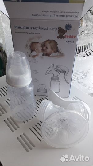 Молокоотсос и накладки на грудь medela