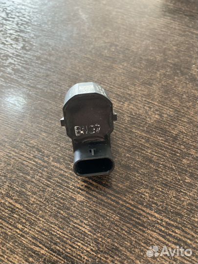 Датчик парковки задний Sportage 957203U000