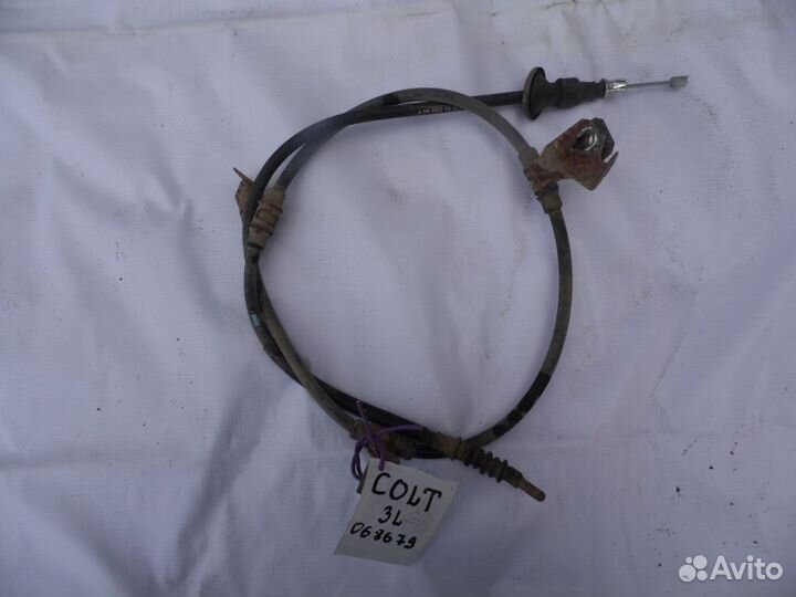 Трос стояночного тормоза левый Mitsubishi Colt (Z3