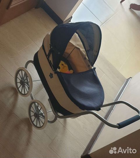 Детская игрушечная коляска