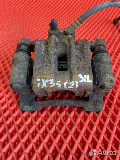 Суппорт тормозной задний левый Hyundai Ix 35 LM