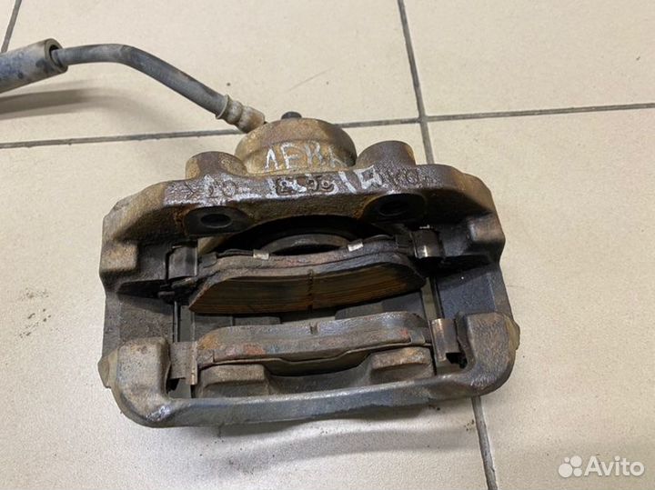 Суппорт передний левый Daewoo Nexia F16D3 2010