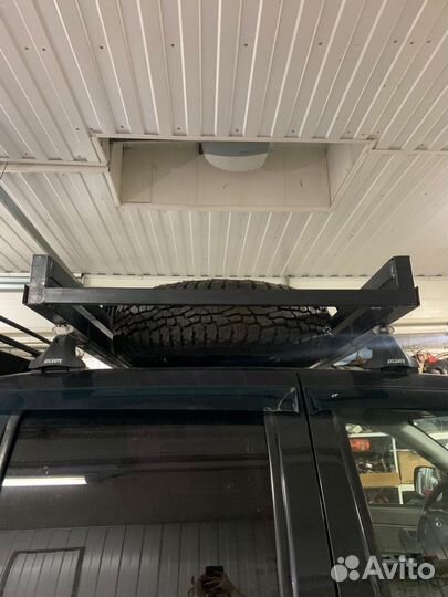 Приспособление для перевозки запасного колеса