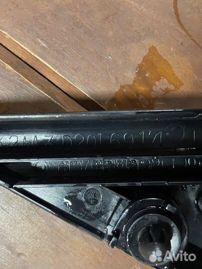 Накладка (уголок) зеркала левый Mazda Demio DW