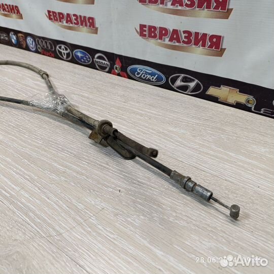 Трос стояночного тормоза левый Honda Domani 1999