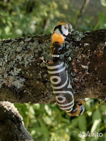 Браслеты с бусинами Дзи