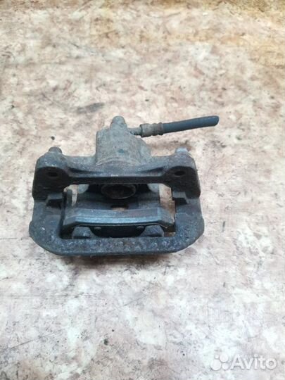 Суппорт тормозной задний левый Chevrolet Lacetti