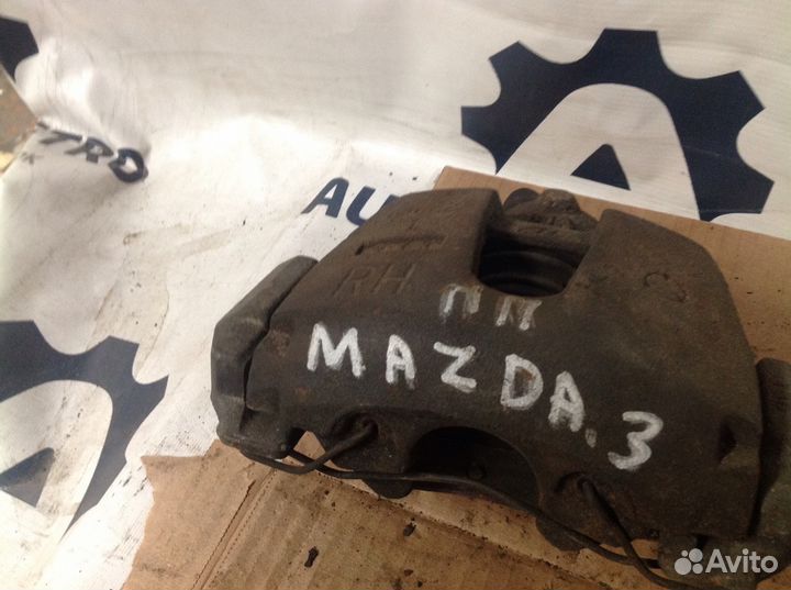 Суппорт тормозной передний правый Мазда. 3