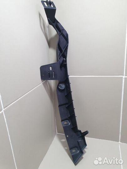 Кронштейн переднего бампера левый Opel Astra J