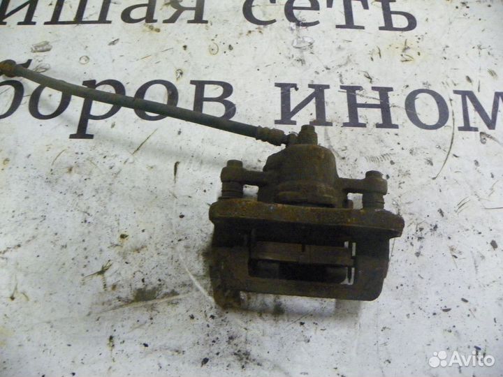 Суппорт тормозной задний левый Kia Sportage II (20