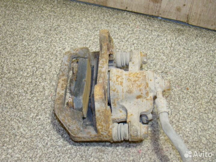 Суппорт задний левый Chevrolet Lacetti