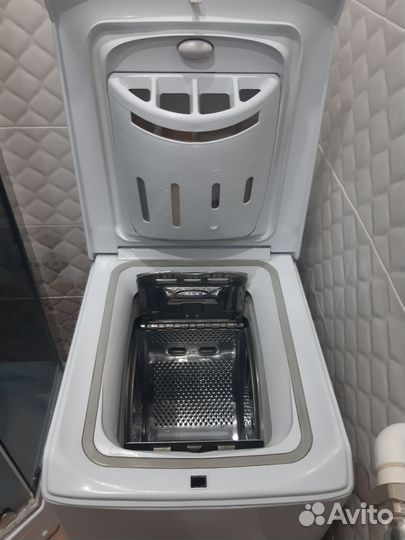 Стиральная машина с вертикальной загрузкой эндзит