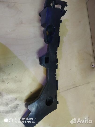 Кронштейн бампера заднего левый Мазда