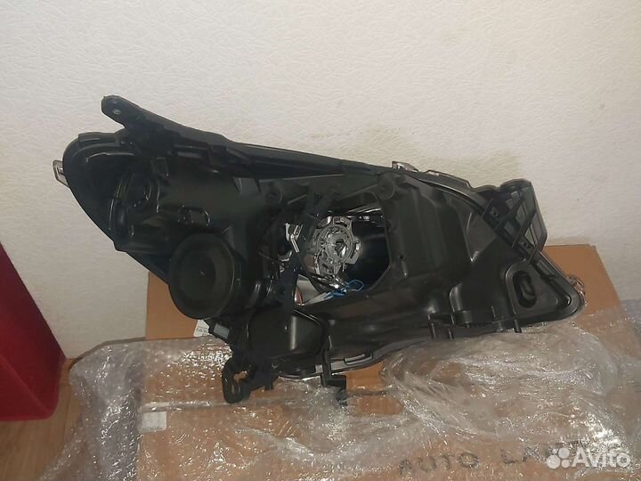 Фара левая Opel Astra h xenon