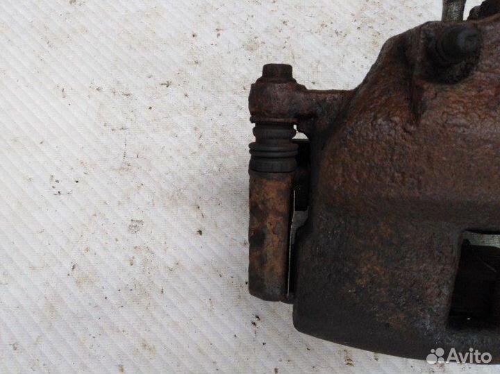 Суппорт тормозной передний правый Nissan Almera N1