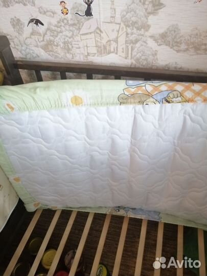 Детская кроватка с продольным маятником