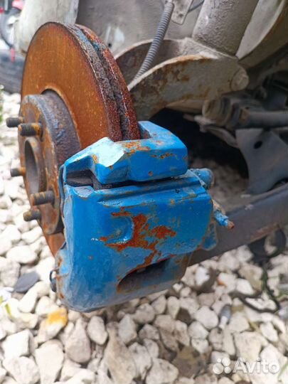 Суппорт тормозной передний Ford Torneo connect