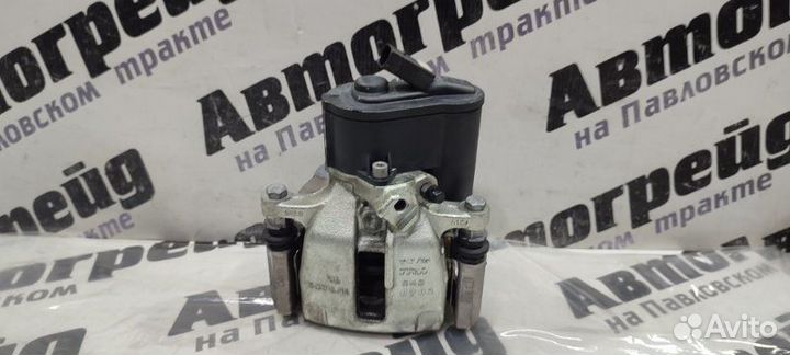 Суппорт тормозной задний левый Volkswagen Passat