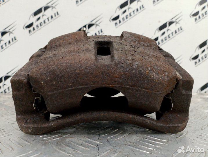 Суппорт тормозной передний левый Nissan Qashqai