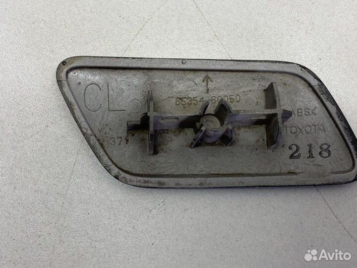 Крышка омывателя фары передняя левая Toyota Land