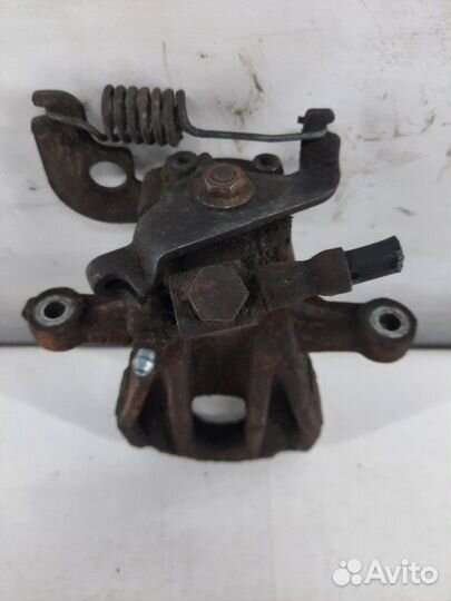 Суппорт тормозной задний левый Jaguar X-Type седан