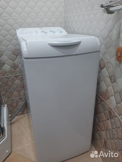 Стиральная машина с вертикальной загрузкой эндзит