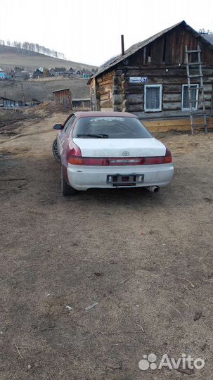 Два бампера на Тойота Карина ед