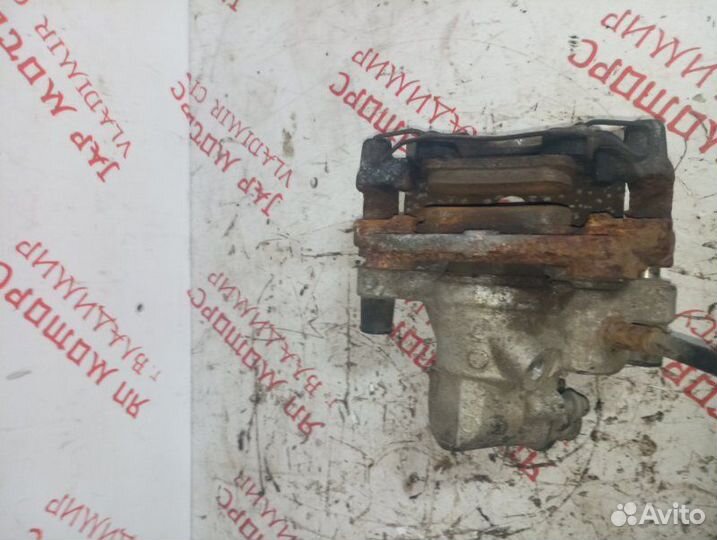 Суппорт тормозной задний правый Mazda 3 Bl седан