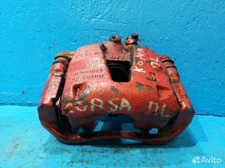 Суппорт передний левый Опель Корса Д