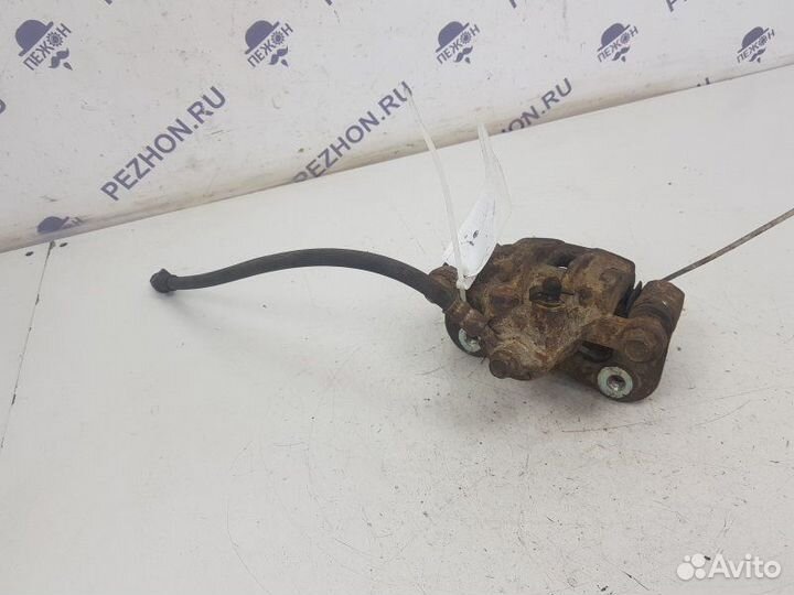 Суппорт тормозной задний левый Kia Sportage