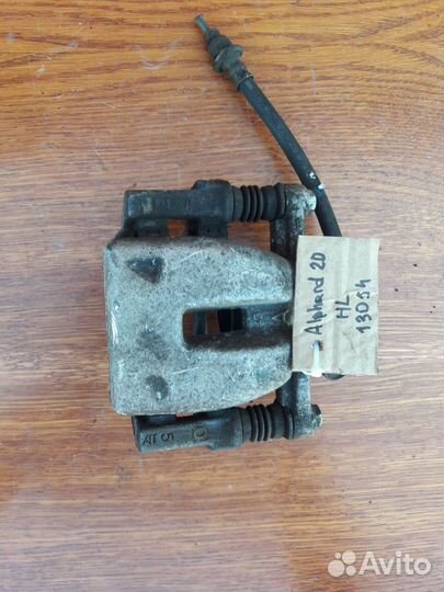 Суппорт задний левый Toyota Alphard 20