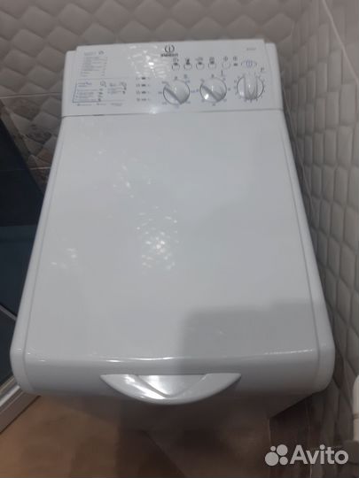 Стиральная машина с вертикальной загрузкой эндзит