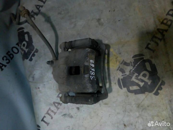 Суппорт тормозной передний левый Nissan Almera N15