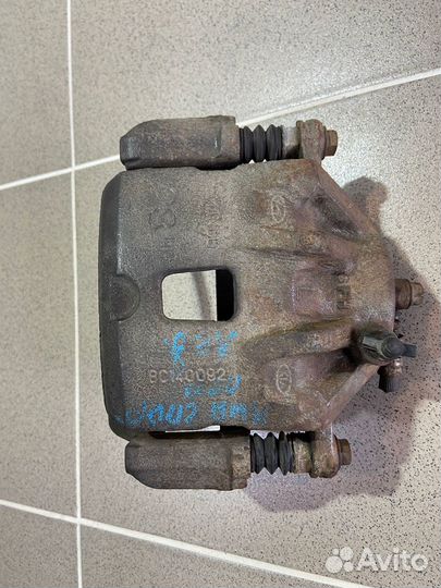 Суппорт передний левый Kia Sportage 2006