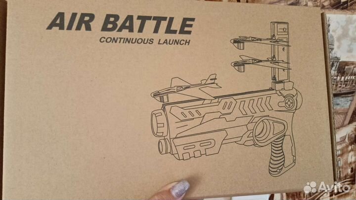 Писталет пускающий самолетики