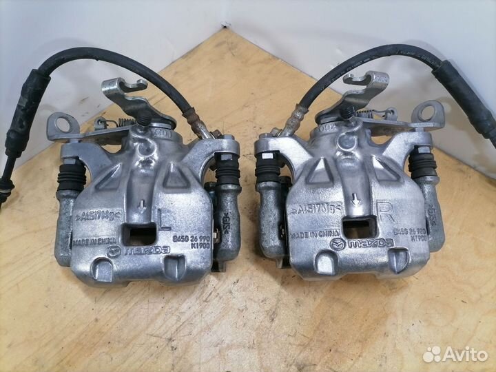 Задний левый тормозной суппорт Мазда 3 BM