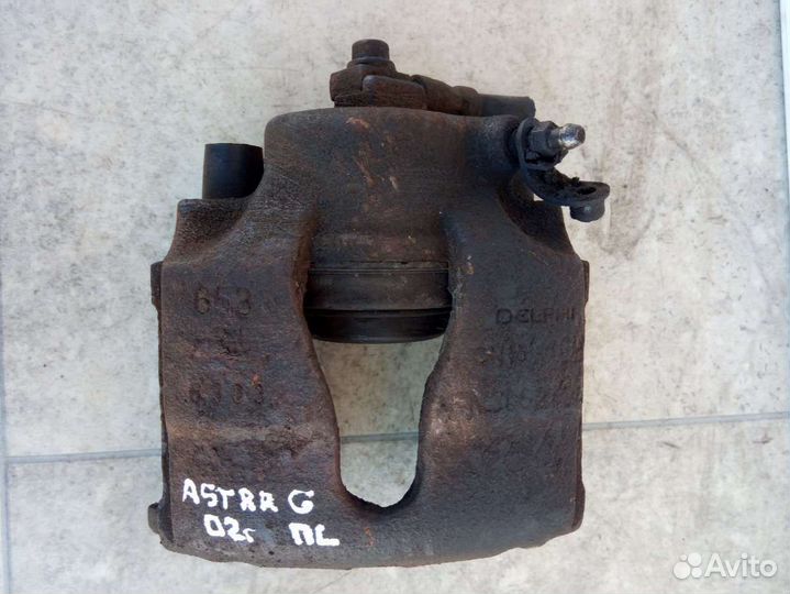 Суппорт тормозной передний левый Opel Astra G