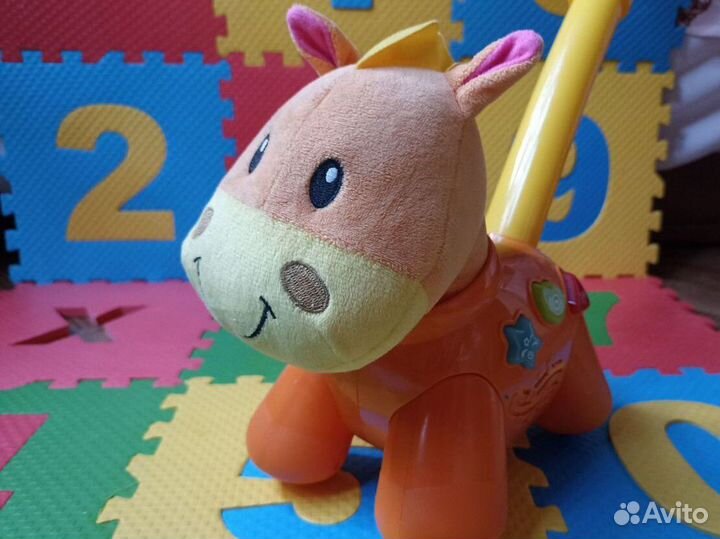 Игрушка каталка Лошадка музыкальная