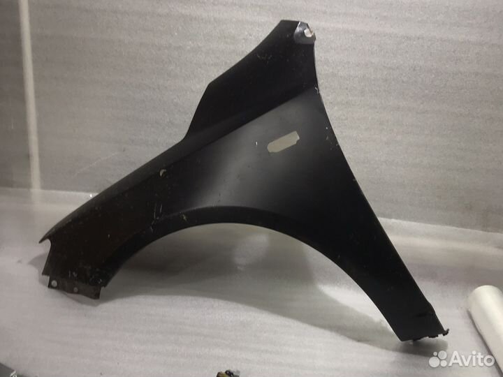 Крыло левое Kia Cerato (09-12г) поворотник