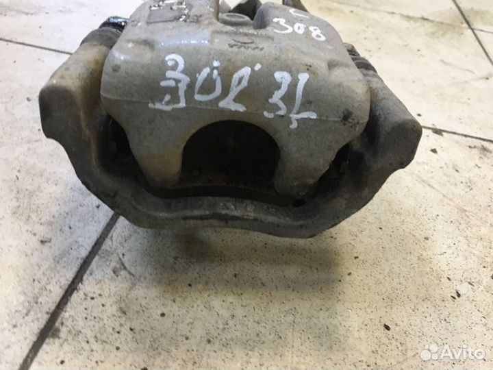 Суппорт тормозной задний левый Peugeot 308