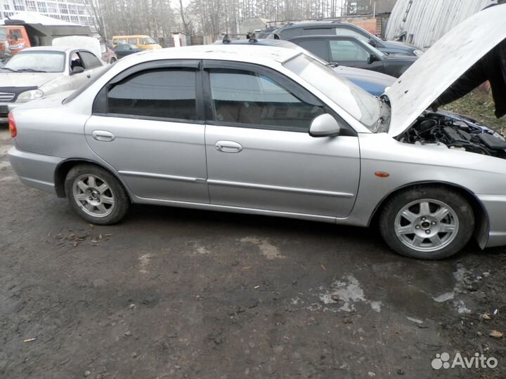 Стекло заднее левое Киа Спектра Оригинал