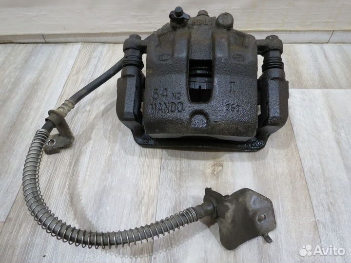 Суппорт тормозной передний правый Kia Rio 4